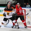 MINSK, BELARUS - MAY 14: Switzerland's Reto Suri #24 battles for position with Germany's Kai Hospelt #18 whiel Rob Zepp #72 attempts to follow the play during preliminary round action at the 2014 IIHF Ice Hockey World Championship. (Photo by Andre Ringuette/HHOF-IIHF Images)
